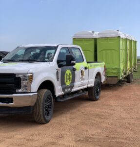 G&G and Dakota Dumper Truck hauling Porta Potties